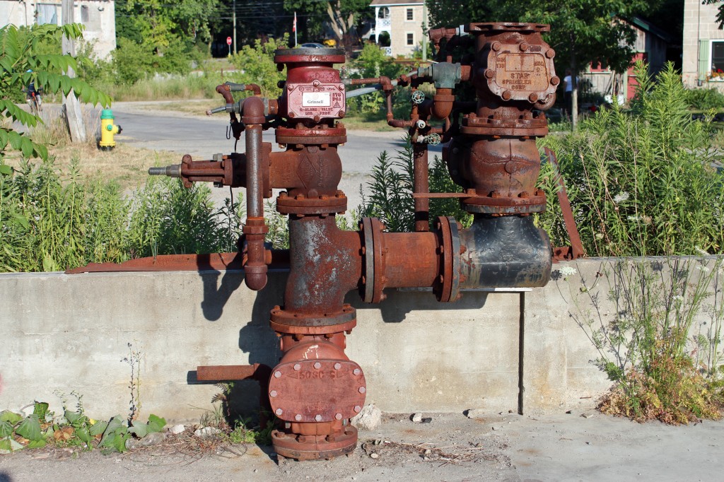 water pipes at elora ontario furniture factory ruins